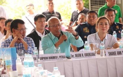 <p><strong>RETURN OF TROOPS.</strong> Defense Secretary Delfin Lorenzana promises Leyte Governor Dominico Petilla (right) and Samar Governor Sharee Ann Tan (left) to send back troops deployed in Mindanao to Eastern Visayas. Photo taken during the Regional Peace and Order Council meeting in Villaconzoilo village, Jaro, Leyte on Friday. (April 13, 2018).<em> (Photo by Philippine Army) </em></p>